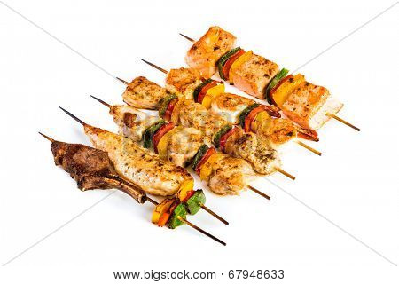 Tasty grilled meat on a white background, shish kebab