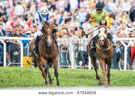 Two Jockeys Into Last Curve At The Nationaldags Galoppen