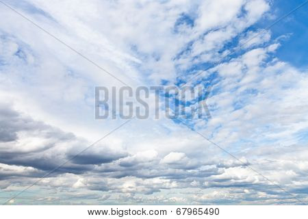 Low Cumuli Clouds In Blue Sky