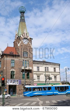 KRAKOW, POLAND - SEPTEMBER 15, 2013: Tram on the street of Krakow. Tramway system operated in the city since 1882, and its length for 2013 was 90 kilometres