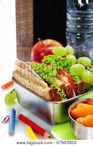 school lunch and  blank chalk board over white