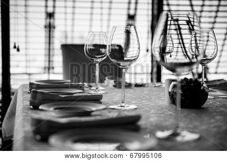 Served Table With Glasses. Black And White Image