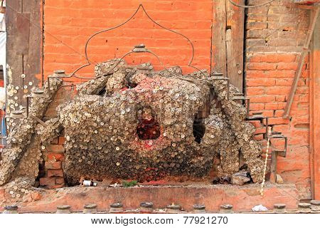 KATHMANDU, NEPAL - APRIL 12 : Danteshwori Devi shrine in Kathmandu, Nepal on 12 April 2014. Peoplewith toothache visit this Tooth Fairy Shrine, nail a coin to  wood, toothache will be cured by god.