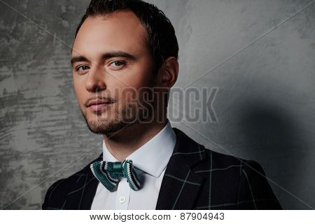 Sharp dressed fashionist wearing jacket and bow tie