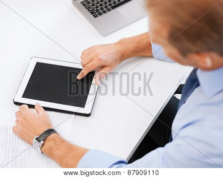 business, office, school and education concept - businessman with tablet pc in office