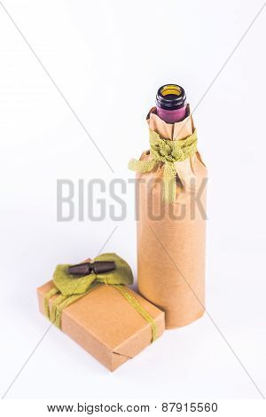 isolated bottle wrapped in paper with the box