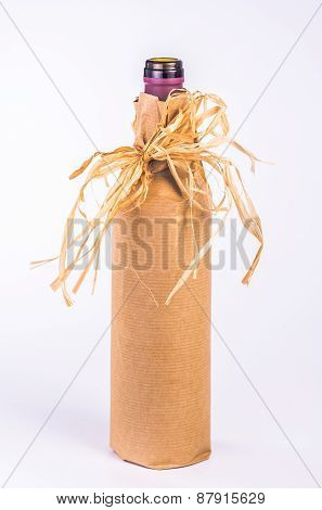 one bottle wrapped in paper with decoration