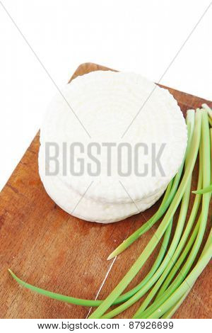 dairy products : feta white cheese on cut board isolated over white background