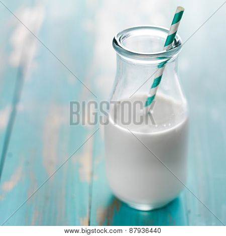 milk in retro glass with stripped staw and copy space