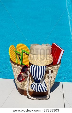 utensils for a nice relaxing vacation day lying next to a swimming pool. relaxation on vacation.