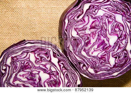 The Fruit Of Red Cabbage Cut With A  Knife