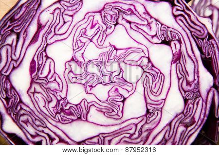 The Fruit Of Red Cabbage Cut With A  Knife