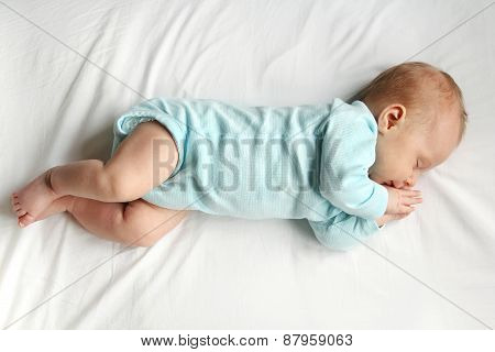 Sweet Newborn Baby Sleeping On White Bed