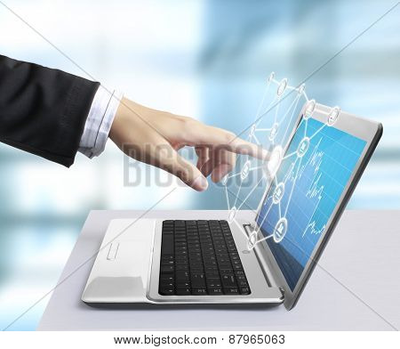 modern laptop and a hand
