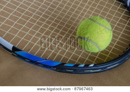 A Tennis Racket With  Tennis Ball