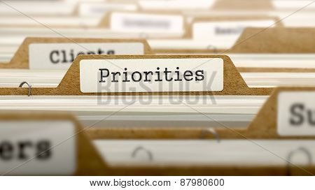 Priorities Concept with Word on Folder.
