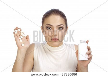 Young Woman Showing Question Mark Made From Pills