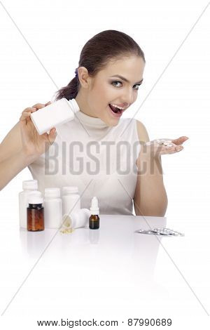 Beautiful Smiling Young Woman Showing A Pill Bottle