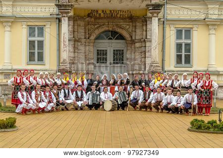 Members of folk group Tashe Miloshevski posing in yard of a well known building Saray in Macedonia.Resen Macedonia on november 25 2013