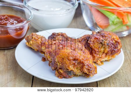 Roasted Chicken Served With Celery And Carrot Sticks, Blue Cheese Dressing And Hot Sauce