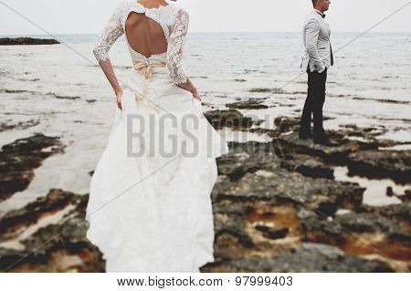 Beautiful  Gorgeous Blonde Bride  And Stylish Groom, On The Background Of A Sea, Wedding Ceremony