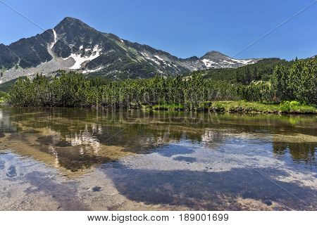 Landscape with Reflection of Sivrya peak in Banski lakes, Pirin Mountain, Bulgaria