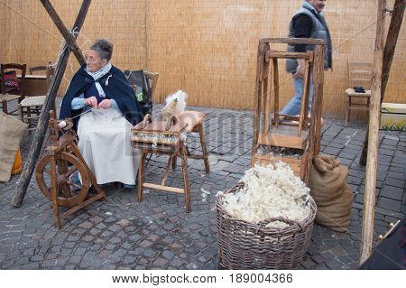 Italy Bologna - November 20 2016: knitter women on their work on market on November 20 2016 in Bologna Emilia Romagna Italy.
