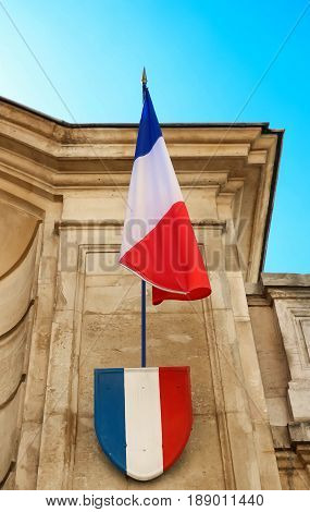The French flag and badge with blue wite red colors.