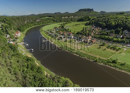 Big rocks near Bastei bridge in valley of river Elbe or Labe in spring sunny day