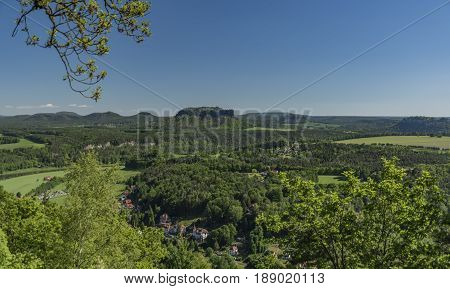Big rocks near Bastei bridge in valley of river Elbe or Labe in spring sunny day
