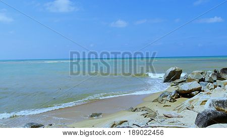 Rocky shoreline of  Ao Manao Beach
Small rocks adorn the white sand beach of Ao Manao in Narathiwat, Thailand.