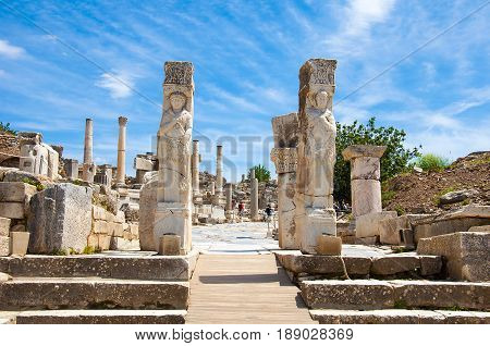 Ephesus. Aydin, Turkey - May 10, 2017: Tourists walking around of  Hercules Gate in   Ephesus , Kusadasi Turkey