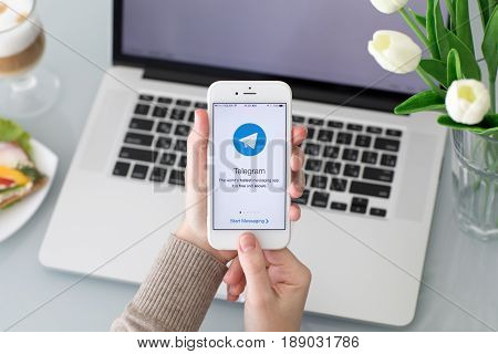 Alushta Russia - May 26 2017: Woman holding iPhone with social networking service Telegram on the screen. iPhone was created and developed by the Apple inc.