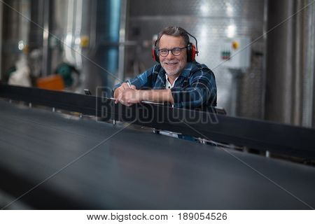 Portrait of male factory worker at drinks production factory