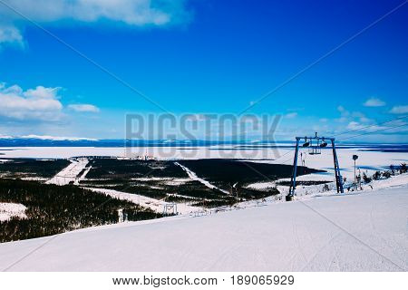 Kola NPP  nuclear power station from the mountain. Industrial landscape. In the background are the mountains of Khibiny and Imandra lake.