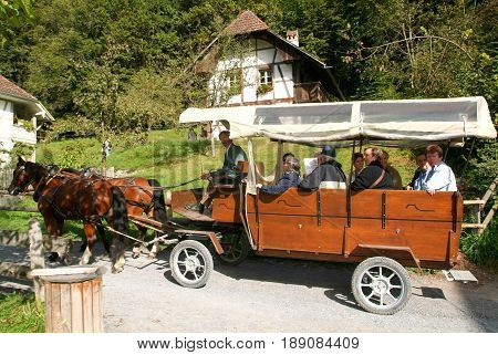 People Visiting On Tourist Buggy  Old Farm Houses