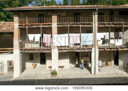 People Visiting On Walking An Old Farm House In Ballenberg