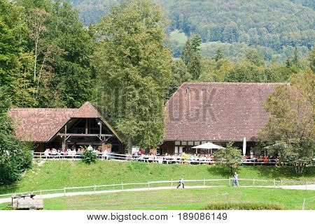 People Eating And Drinking At The Old Restaurant