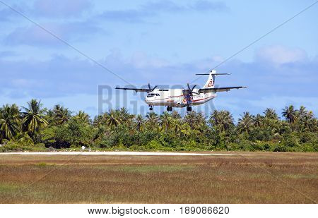 POLINESIA- JUNE 16: screw plane - ATR 72 Air Tahiti companies makes landing on the small tropical island Tikehau on june 16 2011 in French Polynesia
