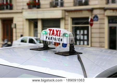 Clodeup of taxicab sign in Paris, France