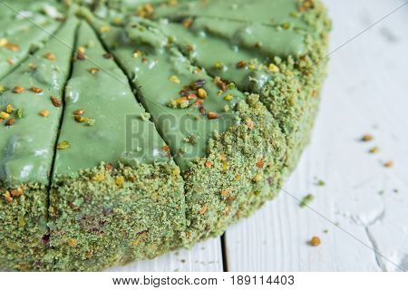 Close up green sliced pistachio cake top view