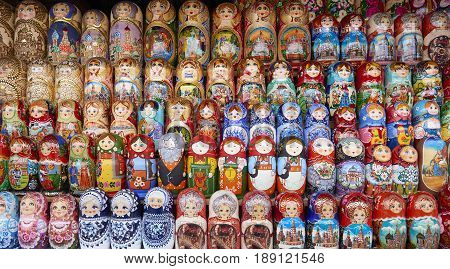 MOSCOW, MAY 26, 2017: Different colors Russian dolls matreshka at souvenir market shop. Traditional classic Russian handicraft art background. Famous classical and modern russian dolls matreshka toys