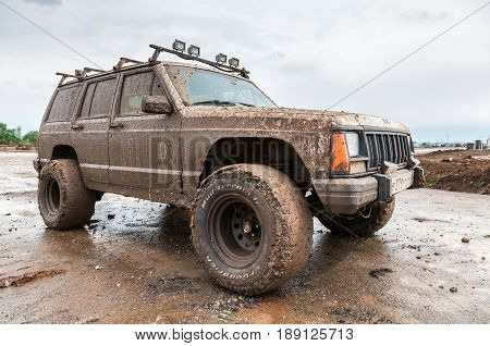 Samara Russia - May 28 2017: Off-road vehicle after driving in the rain on extremely dirty rural road