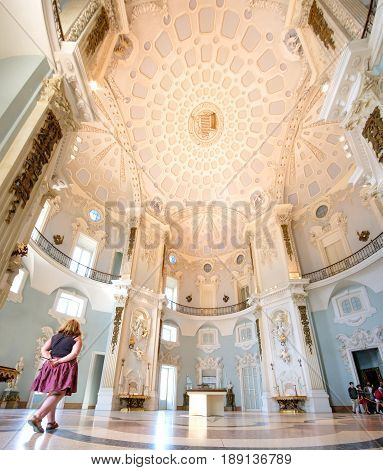 Isola Bella Italy May 22 2017 - a woman walk in the big Palazzo Borromeo building on the Isola Bella island