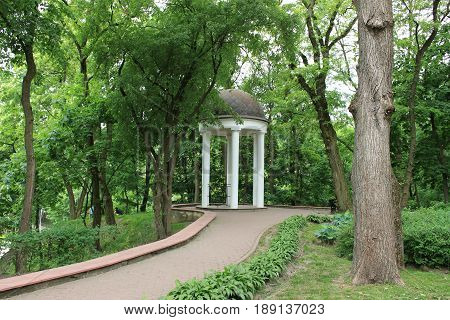 Alcove in the park, trees, bushes, path