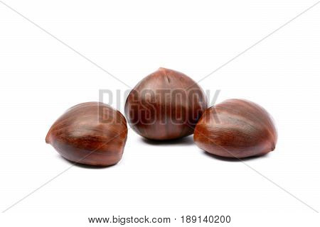 Fresh autumn chestnuts isolated on white background