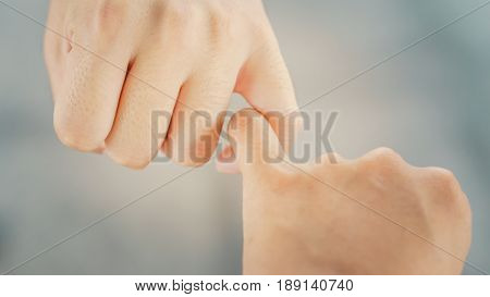 Depth of field, Vintage Style of Two hands hook each other's little finger concept of promise, heal
