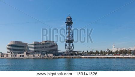 the port of Barcelona at the end of the Ramblas. In the photo the World trade center building and cable way tower in port of Barcelona Catalonia Spain