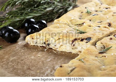 Italian focaccia bread with olives and rosemary.