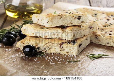 Italian focaccia bread with olives and rosemary.